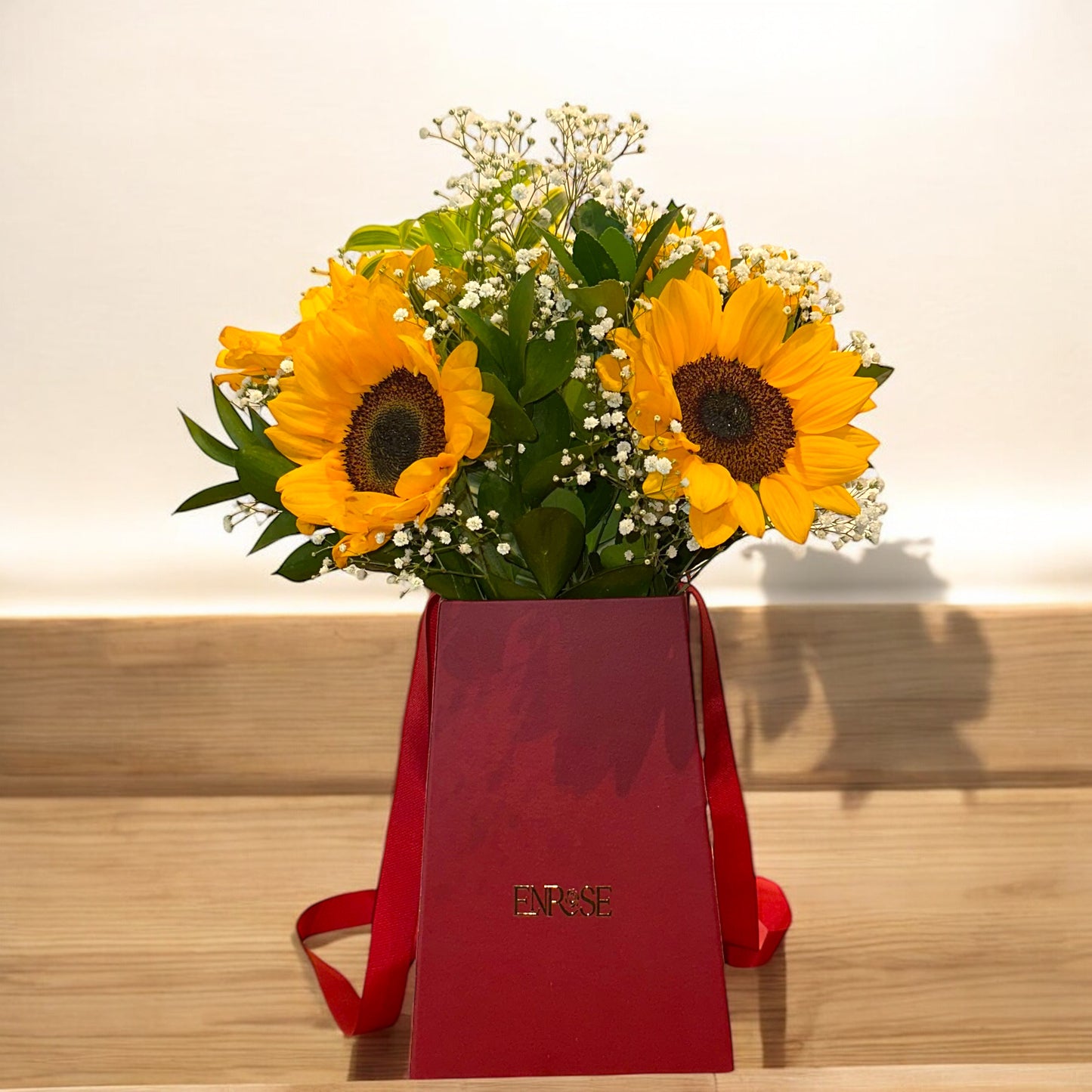Sunflower Arrangement in Red Bag - Vertical Elegance