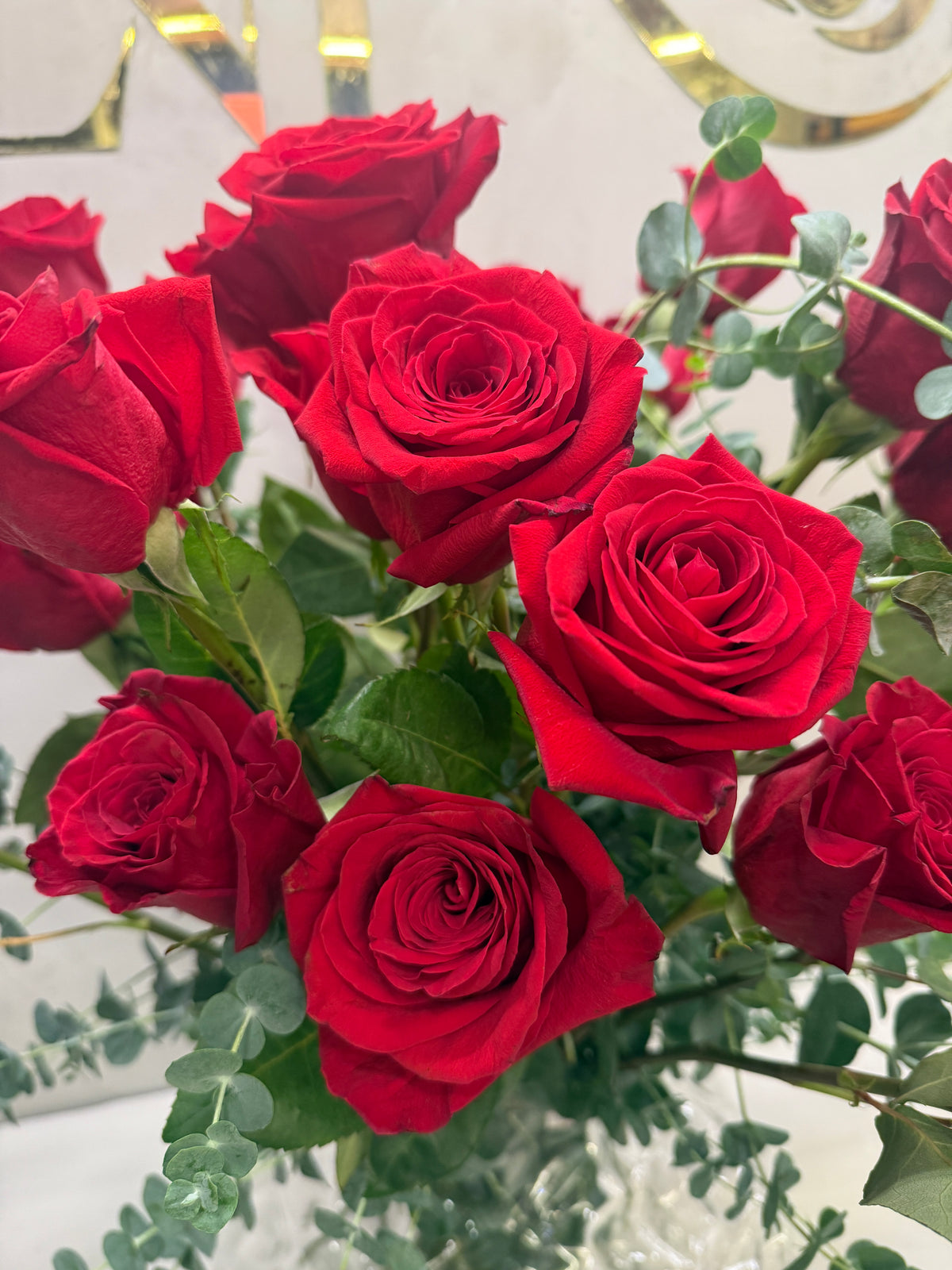 Classic arrangement with 50 Colombian red roses and a crystal vase.