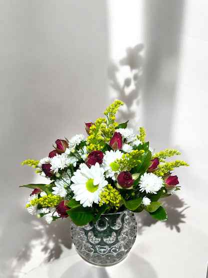 Arrangement of Mini Roses and Daisies in a Glass Vase