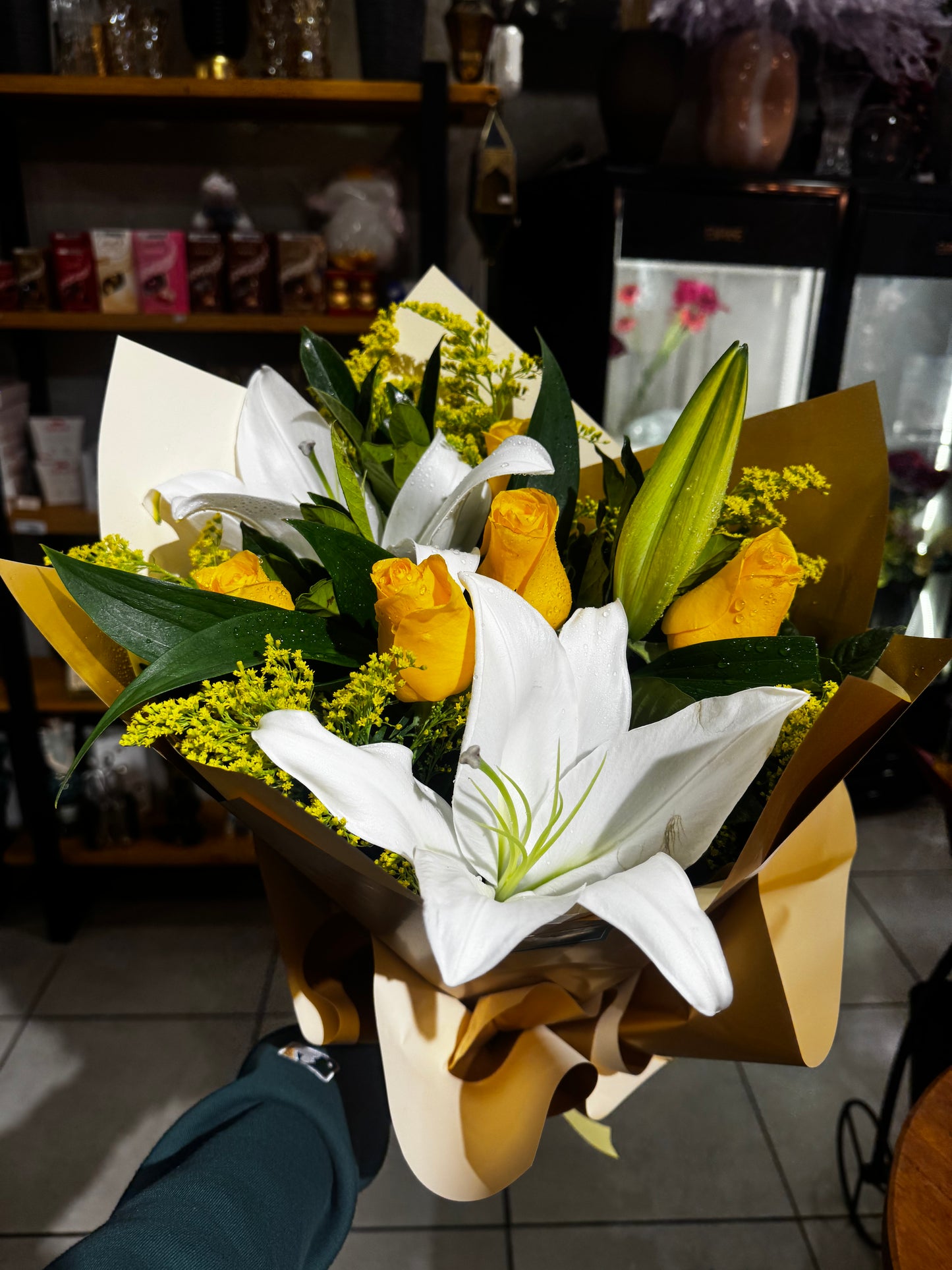 Elegant bouquet with yellow roses and white lilies.