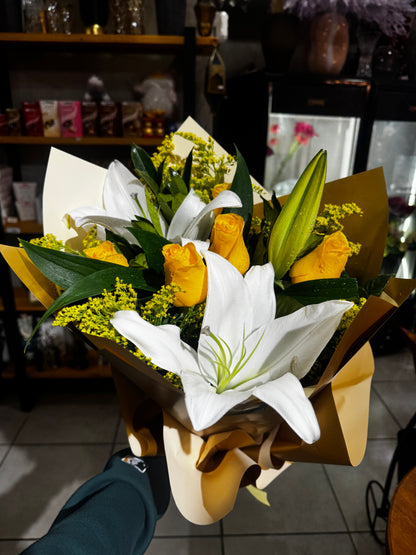 Elegant bouquet with yellow roses and white lilies.