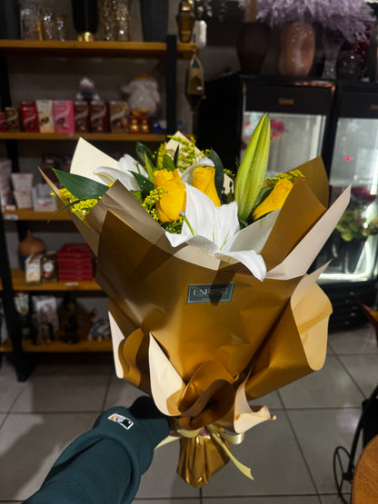 Elegant bouquet with yellow roses and white lilies.