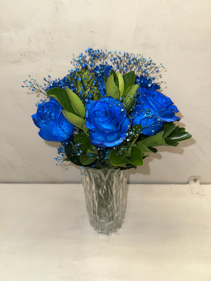 Blue masculine arrangement with glass vase.