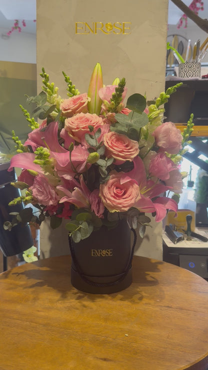 Premium arrangement with roses, lilies, and lisianthus in a cylindrical box ENROSE | Luxury Floral